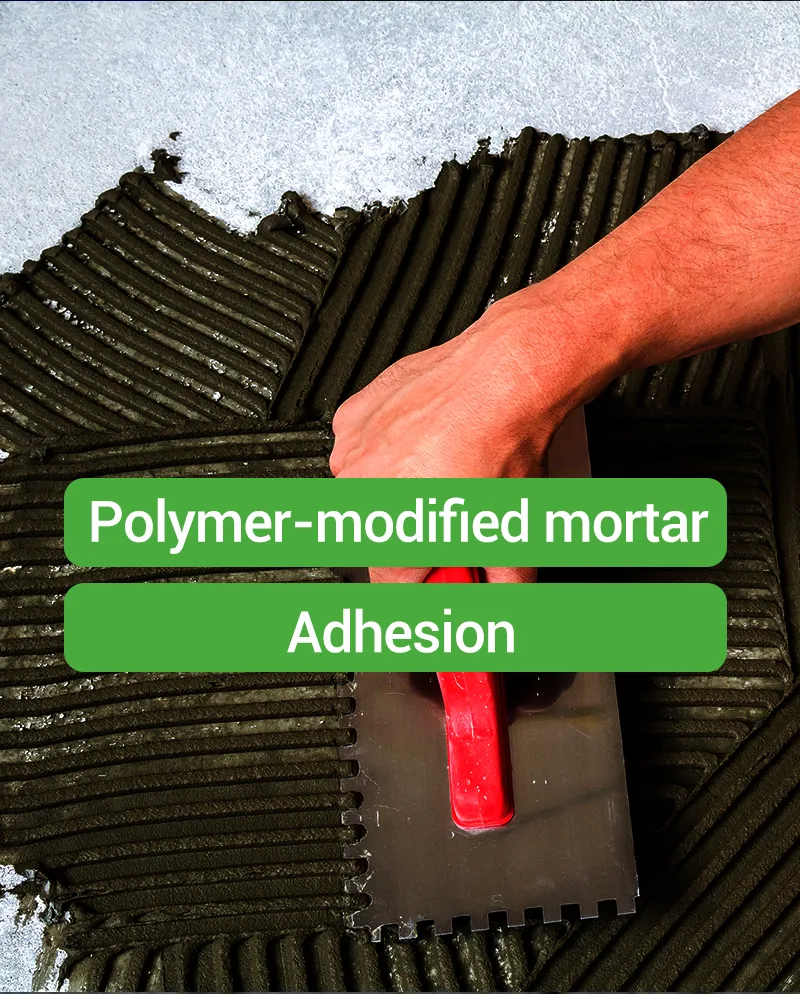 Worker applying polymer-modified tile adhesive mortar with a notched trowel