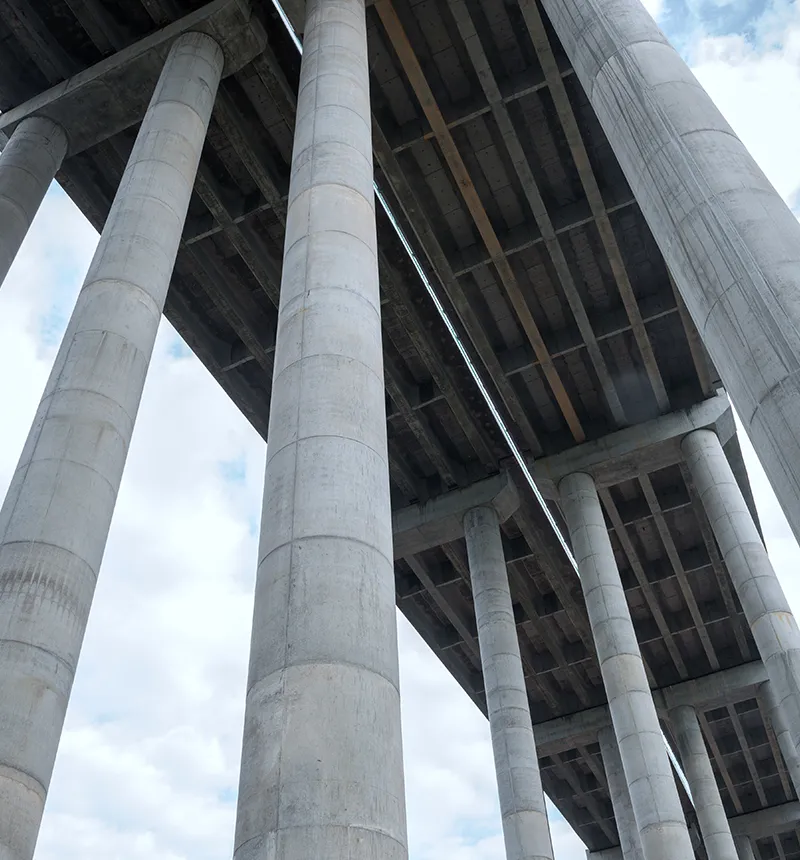 Tall reinforced concrete columns supporting an elevated bridge structure