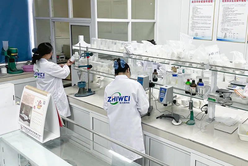 Laboratory technicians conducting experiments with chemical testing equipment